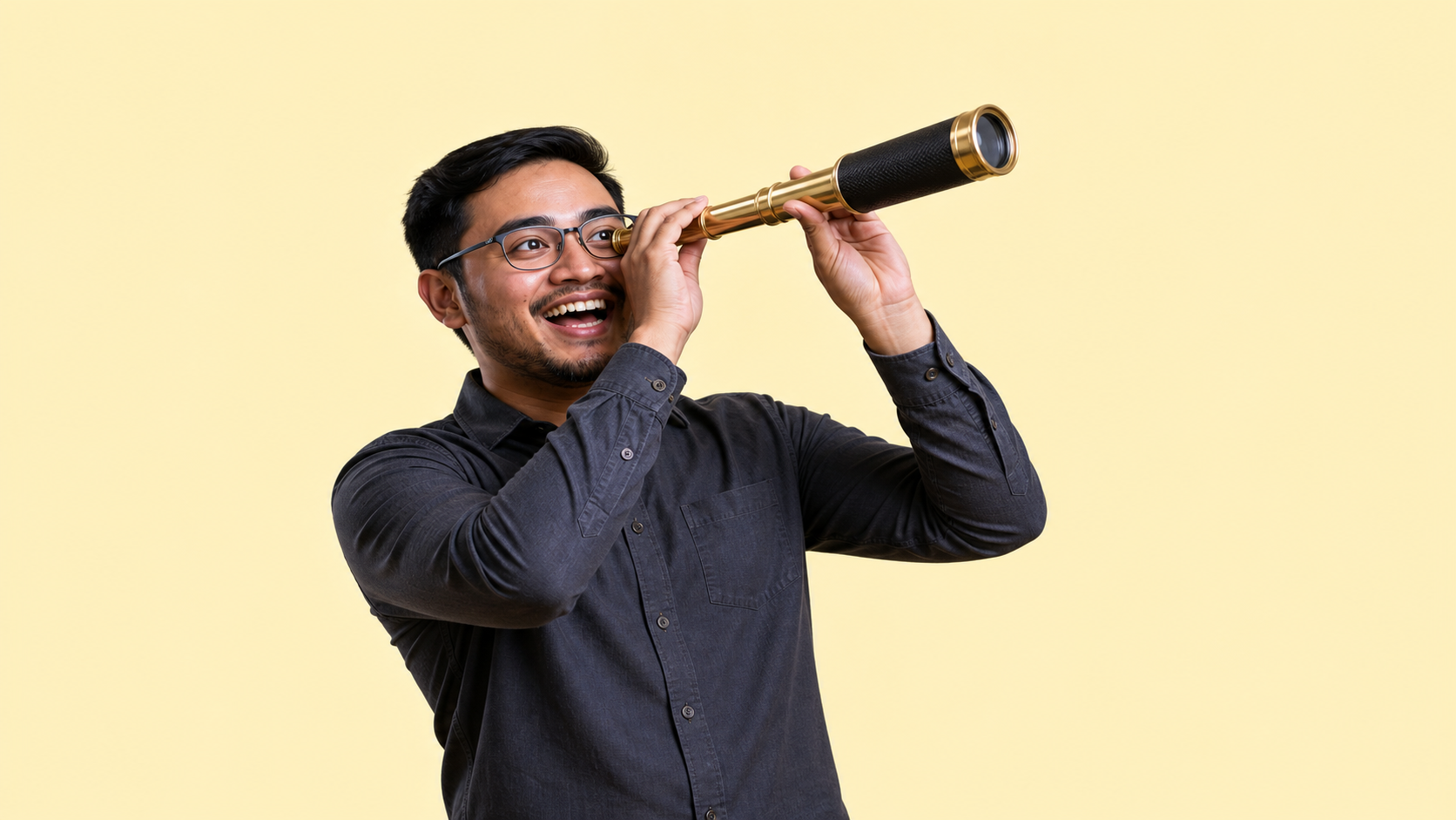 Malaysian performance marketing executive looking through a telescope on a pale yellow background