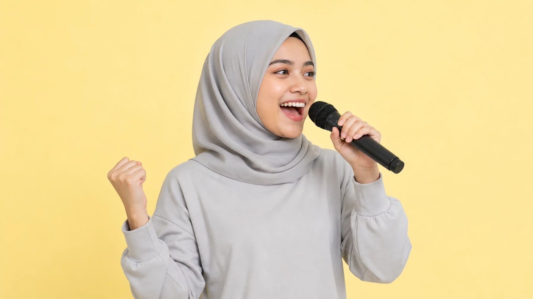 Malaysian performance marketing intern singing karaoke on a warm yellow background
